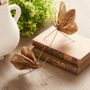 Butterfly tabletop décor from the Melrose Everyday collection featuring nature-inspired accents for wholesale retailers.